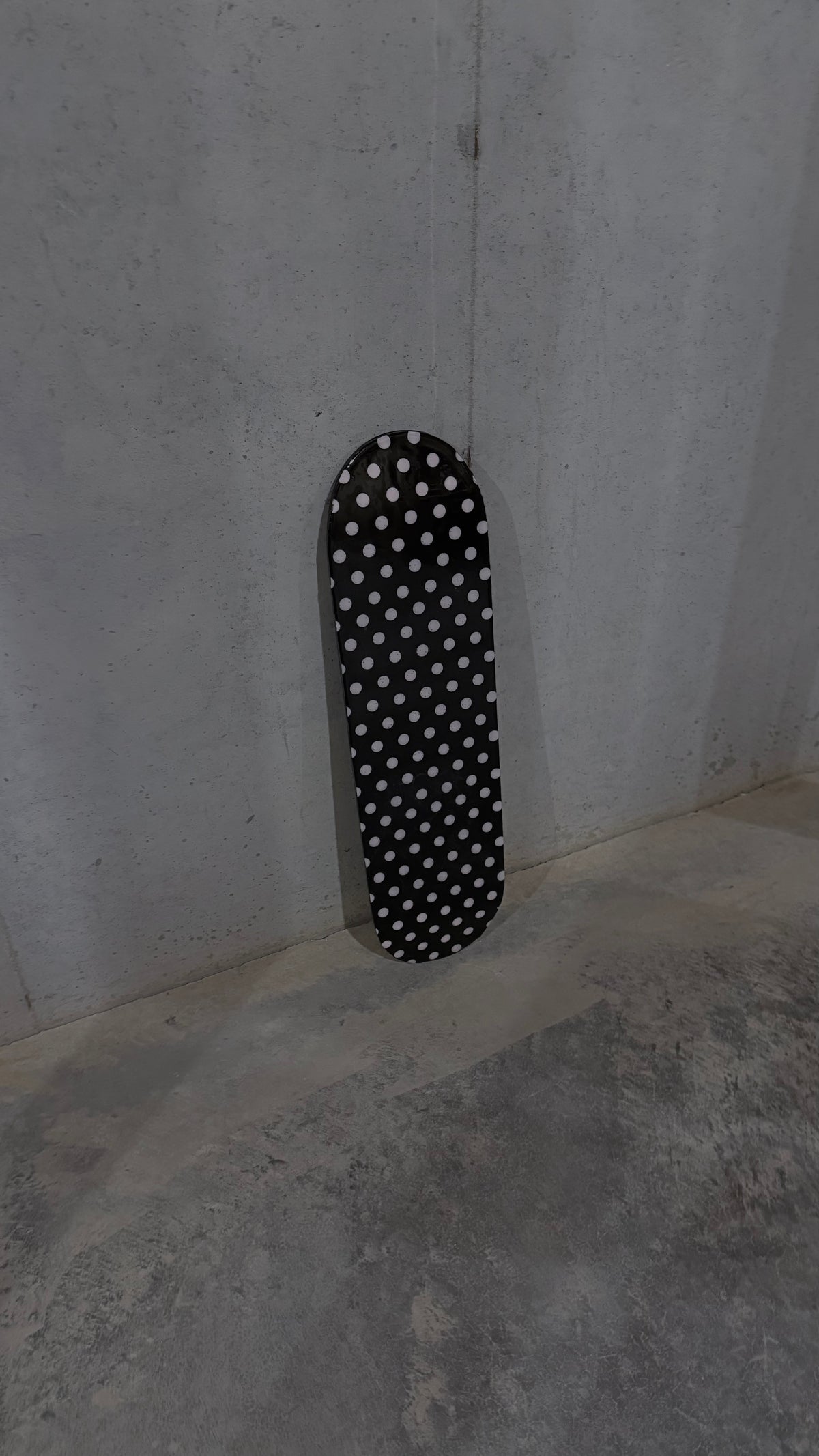 pink and black polka dot skateboard deck