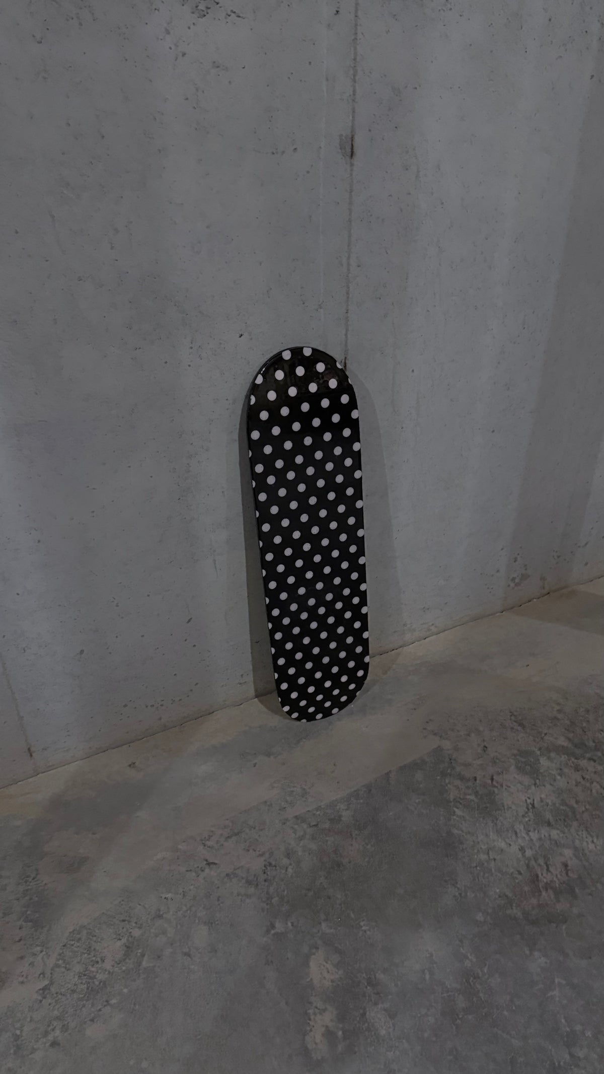 pink and black polka dot skateboard deck