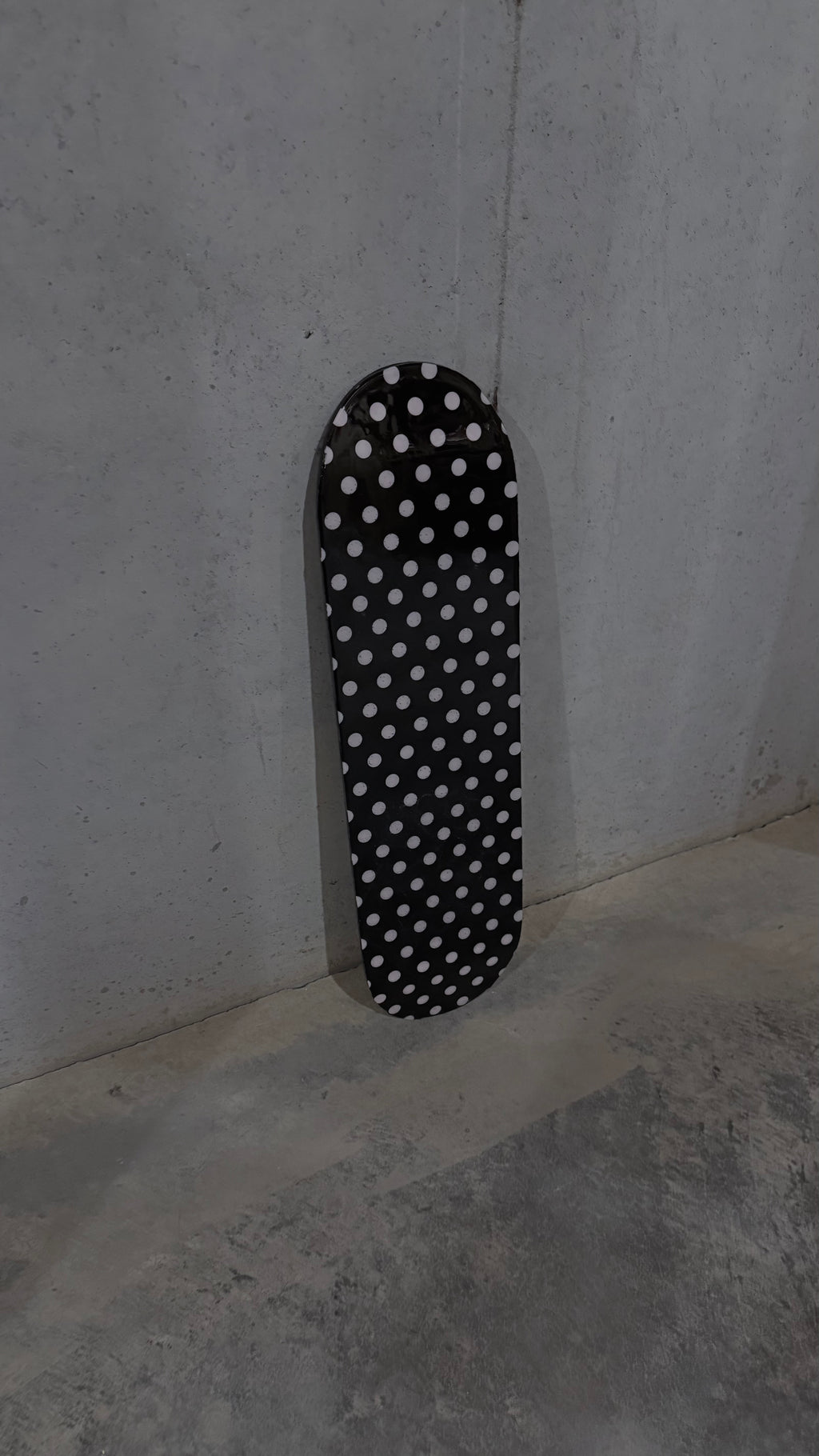 pink and black polka dot skateboard deck