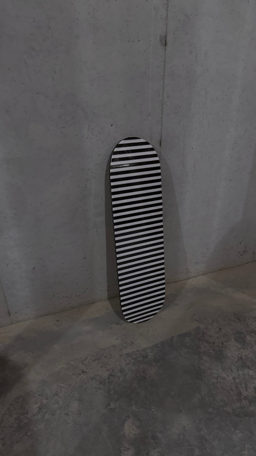 black and white striped skateboard deck